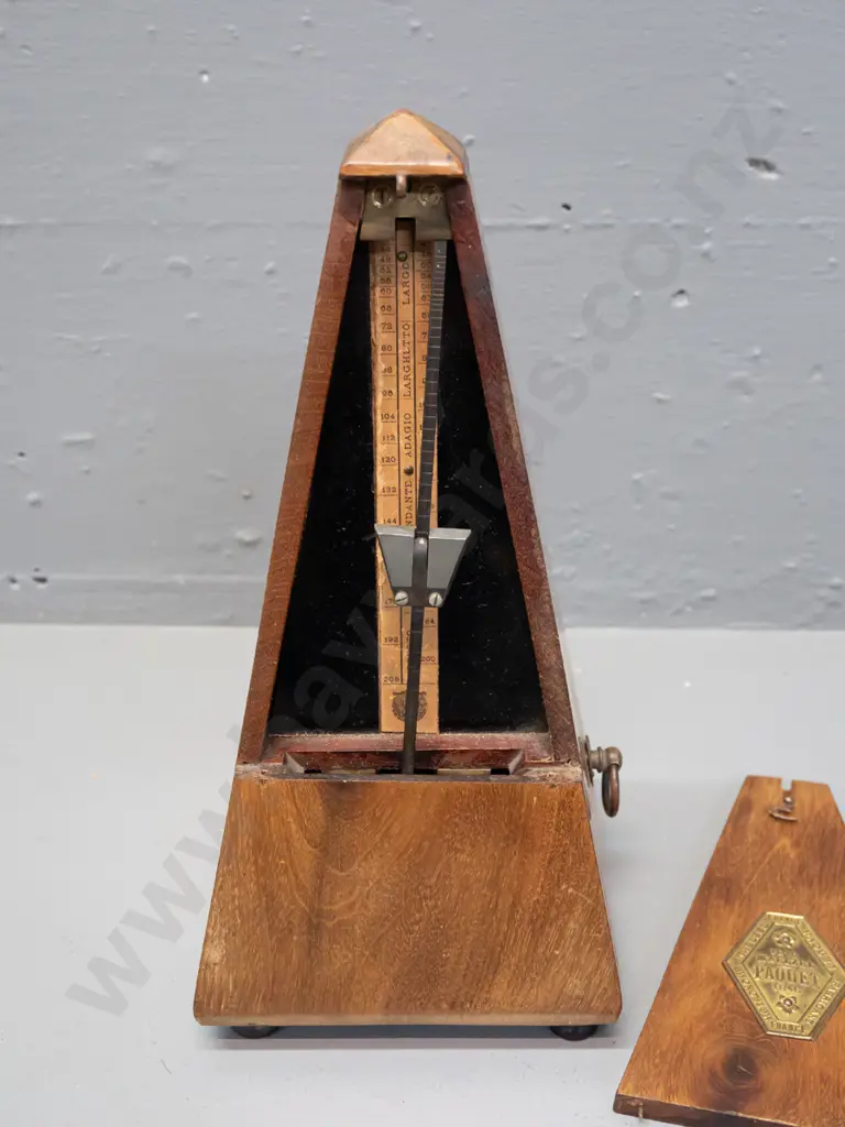 vintage timber-cased metronome Maelzel Paquet France. Working. Some fading and staining to timber, minor crack to case. Image 1++