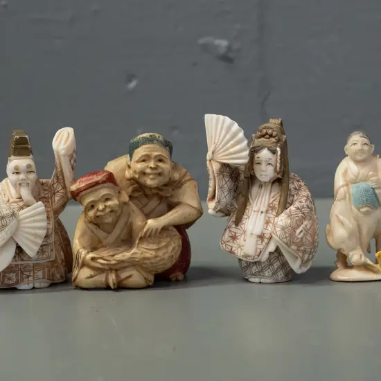 4 faux ivory or bone figures and/or netsuke