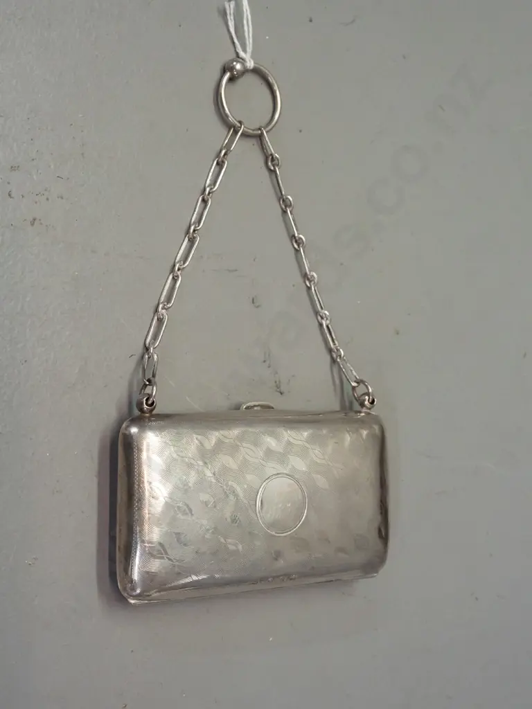 Small sterling silver coin purse w/leather interior and chain handle. Some scratches and dents. H-55 W-95 Image 1++
