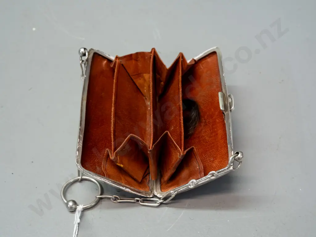 Small sterling silver coin purse w/leather interior and chain handle. Some scratches and dents. H-55 W-95 Image 1++