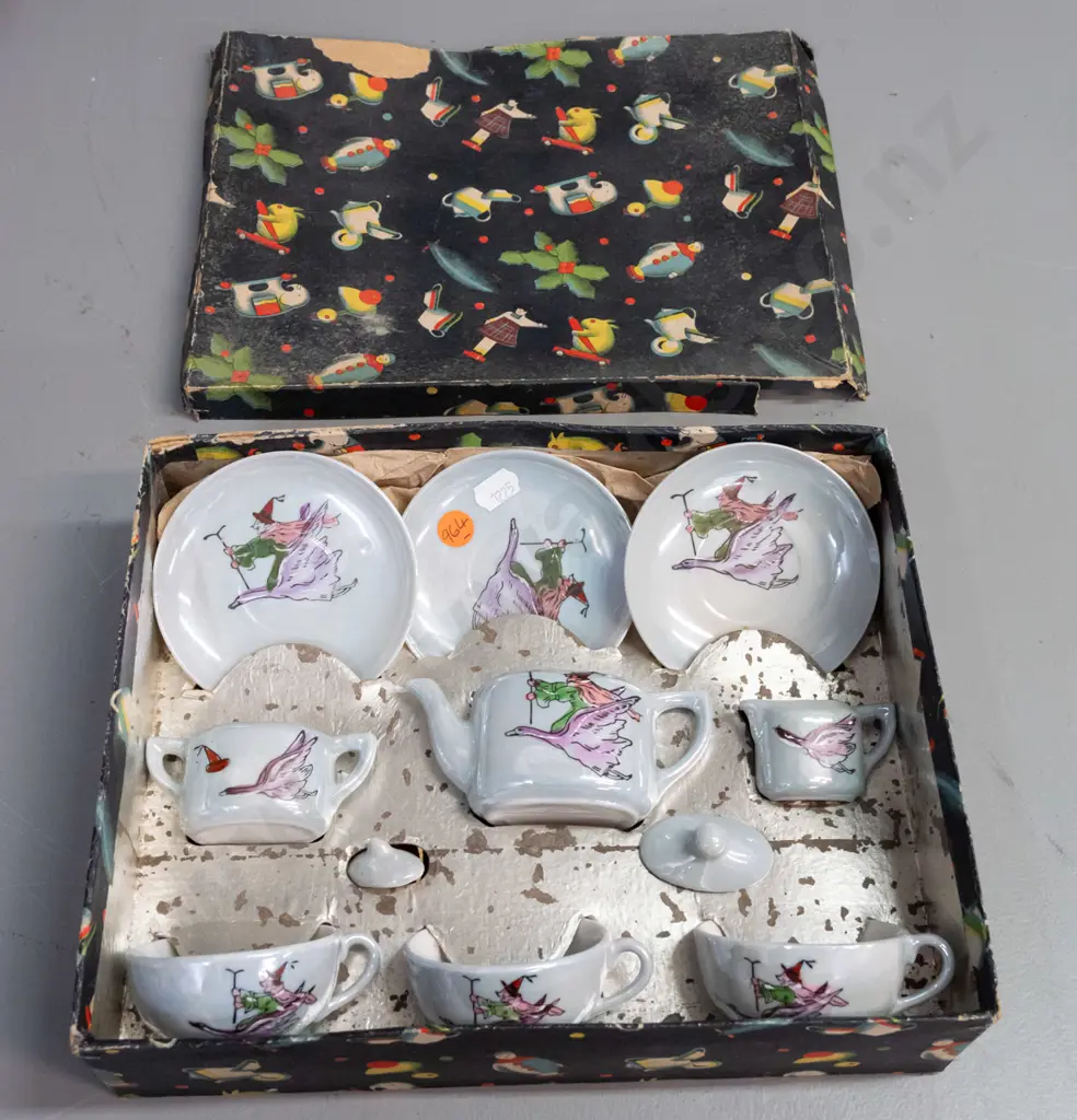 boxed child's tea set with witch riding a goose motif - 3 cups & saucers, teapot, cream & sugar - wear to box Image 1++