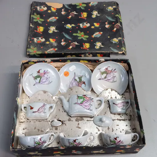 boxed child's tea set with witch riding a goose motif - 3 cups & saucers, teapot, cream & sugar - wear to box