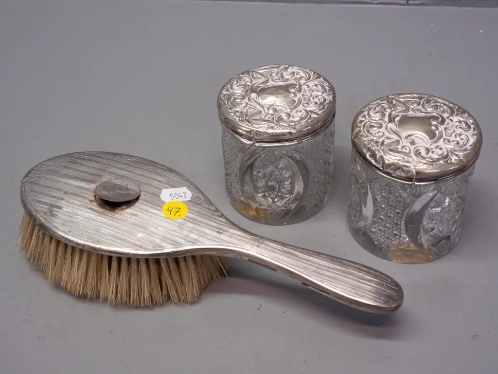 3x sterling silver mounted dressing table items, hairbrush and 2x moulded glass pots. Image 1++