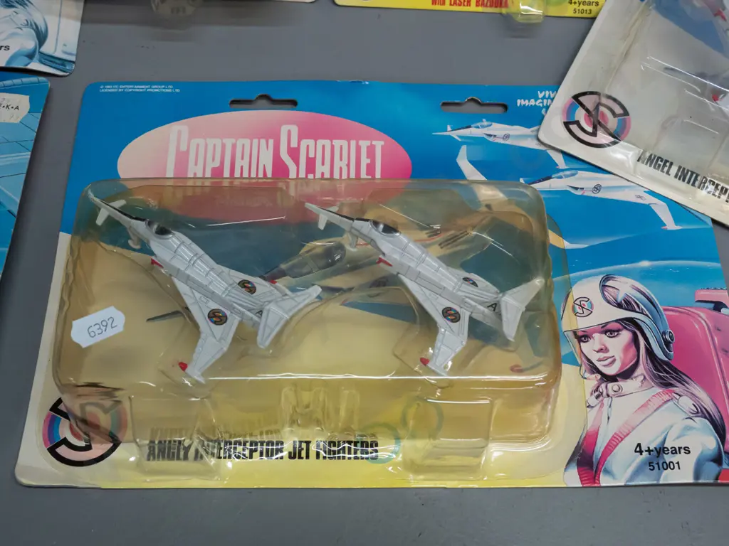 6 carded Captain Scarlett toys in original packaging -   Captain Blue with laser bazooka, Captain Blue's Spectrum Jet Image 1++
