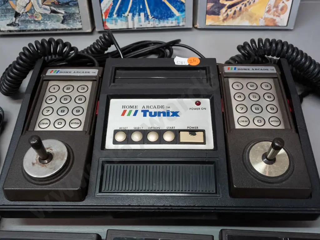 Tunix Home Arcade video game console with attached controllers, power supply, 7 game cartridges (some with boxes, Space Image 1++