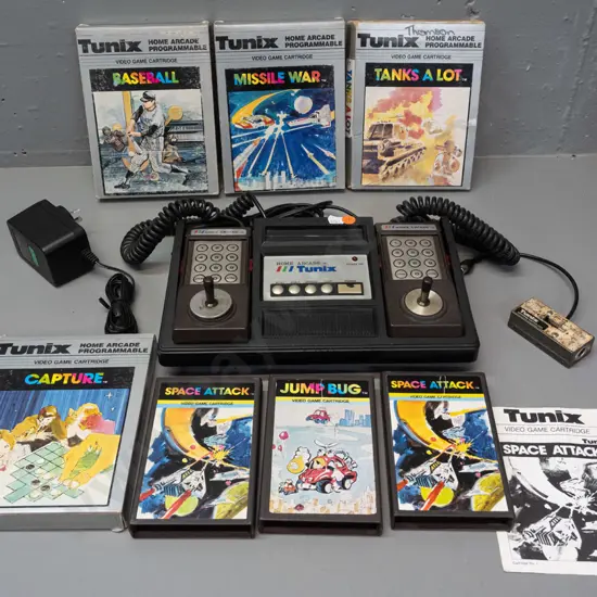 Tunix Home Arcade video game console with attached controllers, power supply, 7 game cartridges (some with boxes, Space