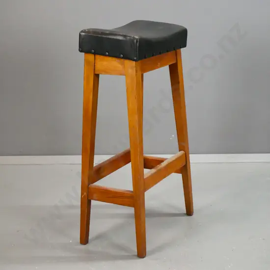 vintage rimu tall stool with slightly saddled and slanted leather upholstered seat H-810 W-410 D-240