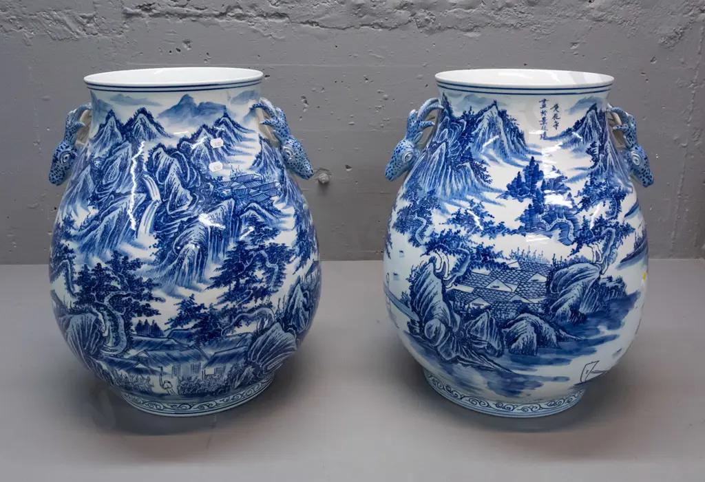 pair of large Chinese blue & white floor vases with flared rim, antelope head handles, landscape & village decoration. Image 1++