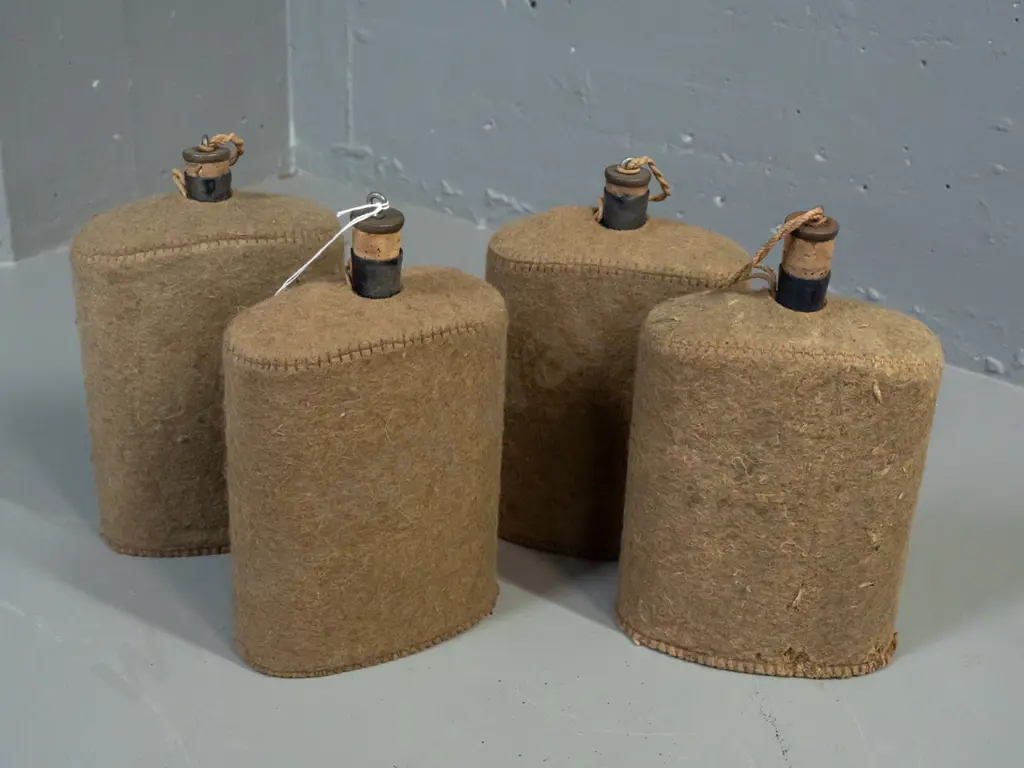 4x WWII-era enameled metal water bottles with felt covers and cork stoppers - insect damage to felt on one. H-210 W-150 Image 1++