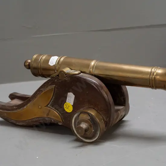 ornamental brass & timber cannon. Some staining & marks to timber. L-300