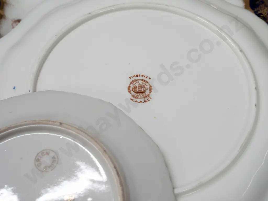 7 pieces of gilt trimmed china - 4 plates & a square dish marked "Kimberley / W.A.A. & Co." and 2 pieces of Orion China Image 1++