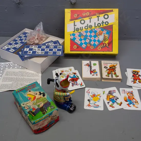 3 vintage toys and games - wind-up Japanese "Candy Loving Canine" tin toy, Lotto game and German card game - some wear