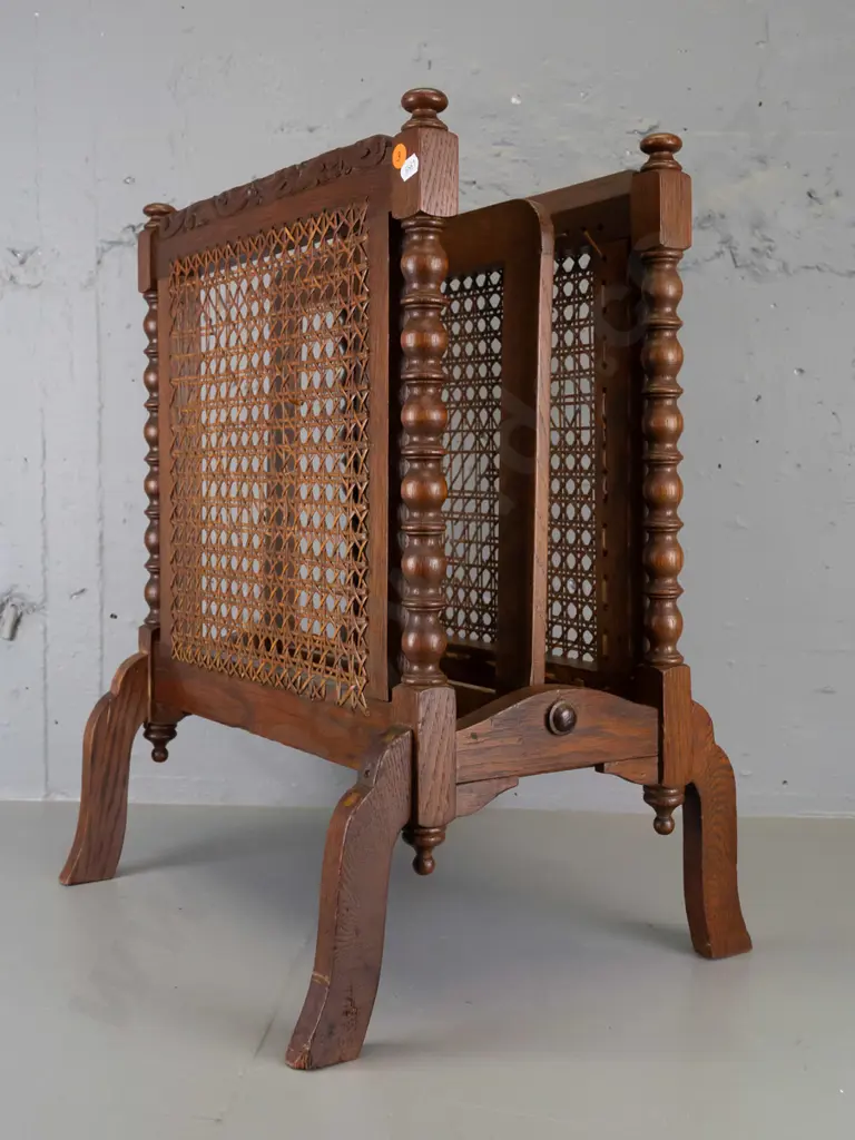 vintage dark-stained oak magazine rack with turned spindle ends and finials, 2 woven cane panels - minor damage to cane, Image 1++