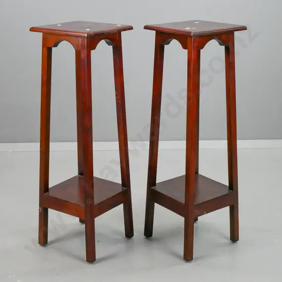 pair of reproduction mahogany plant stands with square tops, splayed square section legs & bottom platform - some