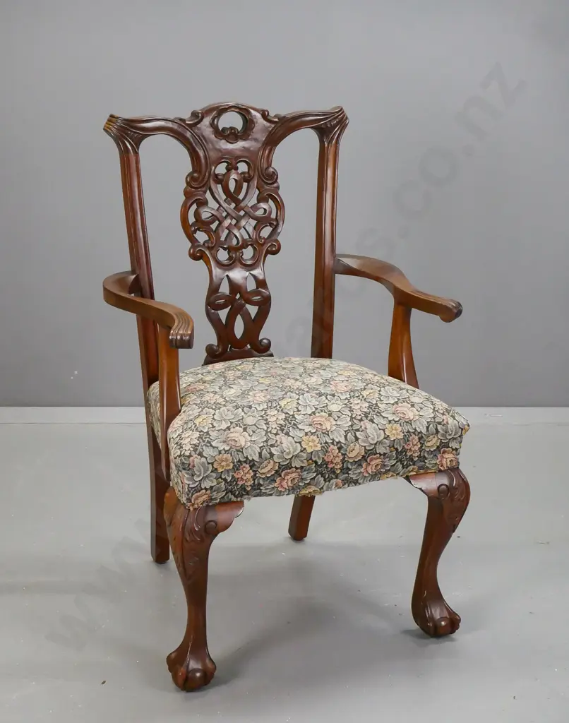 mahogany Chippendale-style open-arm chair with floral upholstered seat, carved and pierced back splat, claw & ball Image 1++