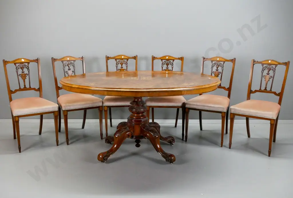 Victorian oval tilt-top table with walnut top, boxwood stringing & floral inlay, on 4-point carved elm pedestal base, Image 1++