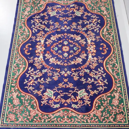 Turkish machine woven floor rug with "Kale" maker label, in blue and green - minor fraying to fringe L-1940 W-1380