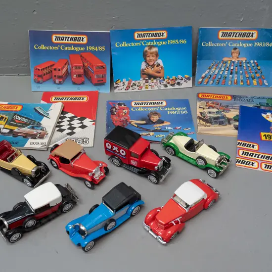 7 Matchbox Models of Yesteryear die-cast cars and 8 assorted Matchbox catalogues from 1979 thru 1988