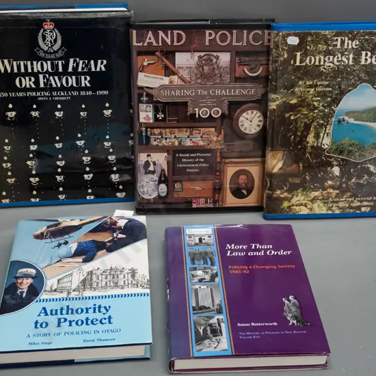 5 books on New Zealand police history, 2 signed by authors, 3 with book guard on covers and some wear and tape residue