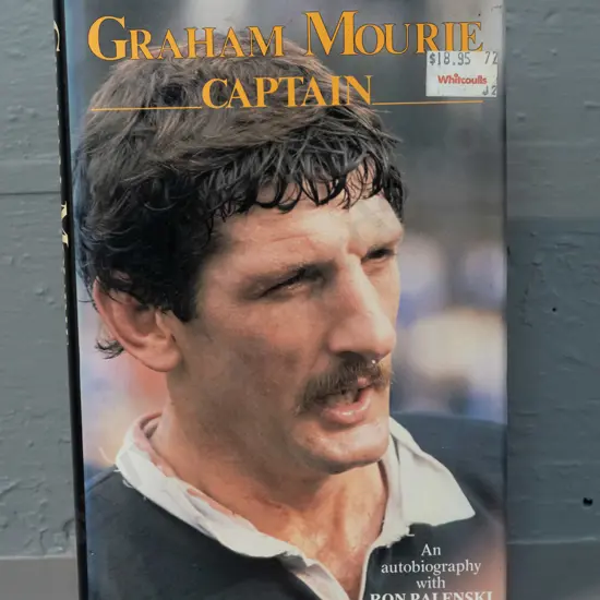 autographed hard cover book - signed by Graham Mourie - see photo for details - minor fading to dust cover