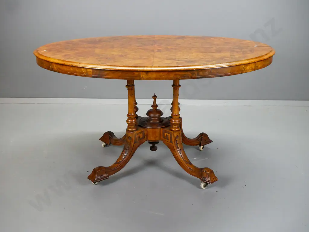 Victorian oval tilt top table with walnut top with boxwood inlay and stringing, on 4-point cathedral base, foliate Image 1++
