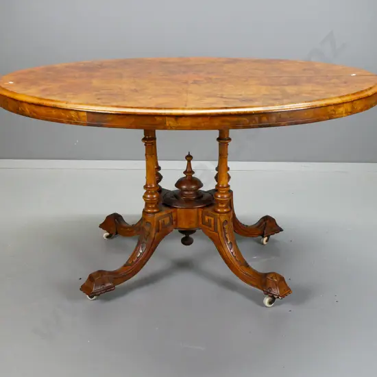 Victorian oval tilt top table with walnut top with boxwood inlay and stringing, on 4-point cathedral base, foliate