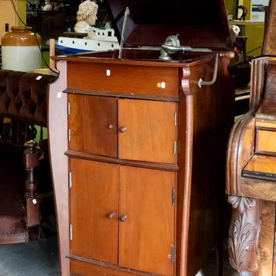 vintage wind-up gramophone in mahogany cabinet with 2 door record storage cupboard and 2 speaker cabinet doors, one w/