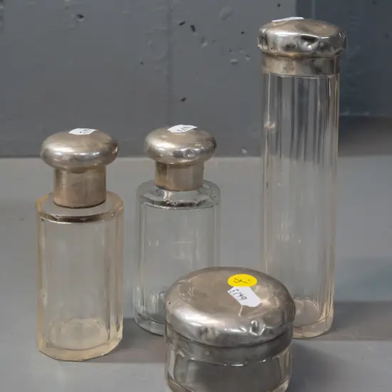 4-piece Glass and Sterling Silver dressing table set. Tops marked '950 HG'. Small chips to glass, denting to silver lids