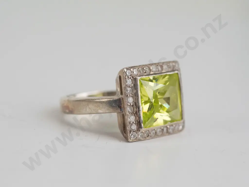 cz and peridot? sterling silver ring - size O.5 Image 1++