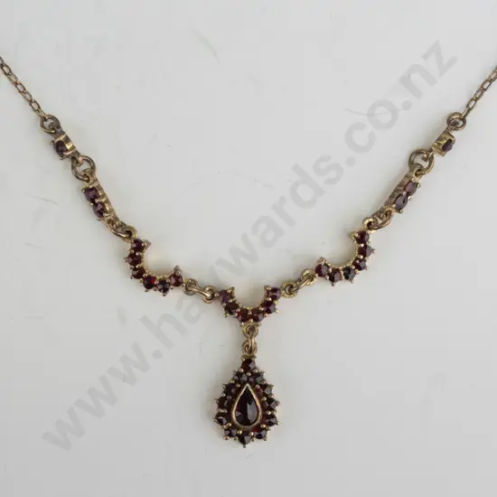 red stone pear drop pendant gold plated - no mark