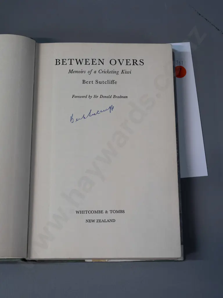 autographed hard cover book - Between Overs, signed by Bert Sutcliffe - see photo for details - some damage & Image 1++