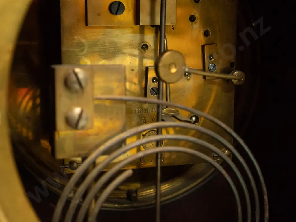 vintage wood-cased mantle clock w/ mixed timber inlay decoration, on brass ball feet. Enameled metal face. Untested Image 1++
