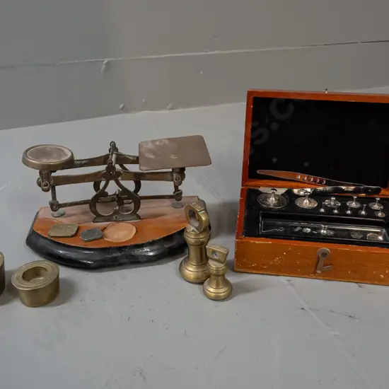 small postal style balance scales with assorted brass weights and a cased set of chrome weights - brass bucket weights