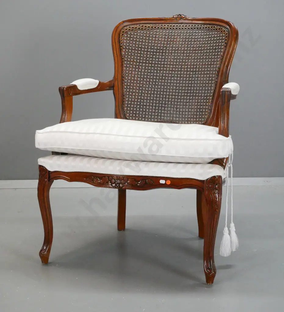reproduction French style open-armed chair with cane back, upholstered arm rests and seat with cushion - minor staining Image 1++