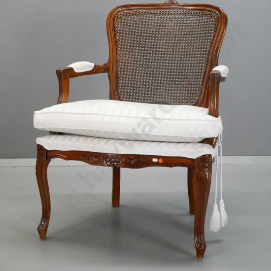 reproduction French style open-armed chair with cane back, upholstered arm rests and seat with cushion - minor staining