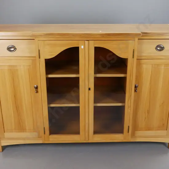 reproduction rimu break-front sideboard with 2 shaped glazed doors, one solid door, 2 interior shelves, 2 drawers, metal