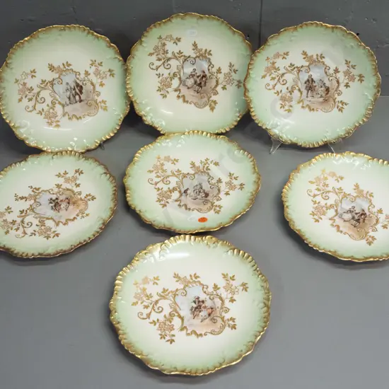 7 Limoges plates with rococo style decoration, various romance scenes - some w/ wear to gilt edging D-220