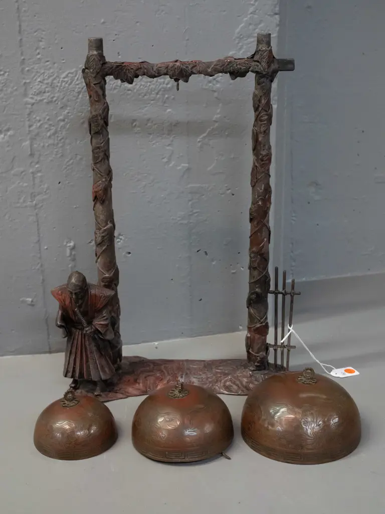 vintage decorative metal stand with Samurai guard figure and 3 hanging brass or bronze temple bells with engraved Image 1++