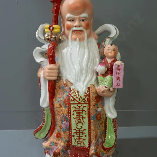 large Chinese figure - bald headed man with staff. Small glaze flaw under dragon's head H-650 W-260