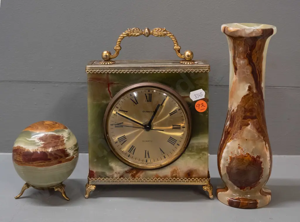 3 pieces of agate or polished stone with brass finish fittings - mantel clock, orb on tripod base, and a vase. Steiger Image 1++