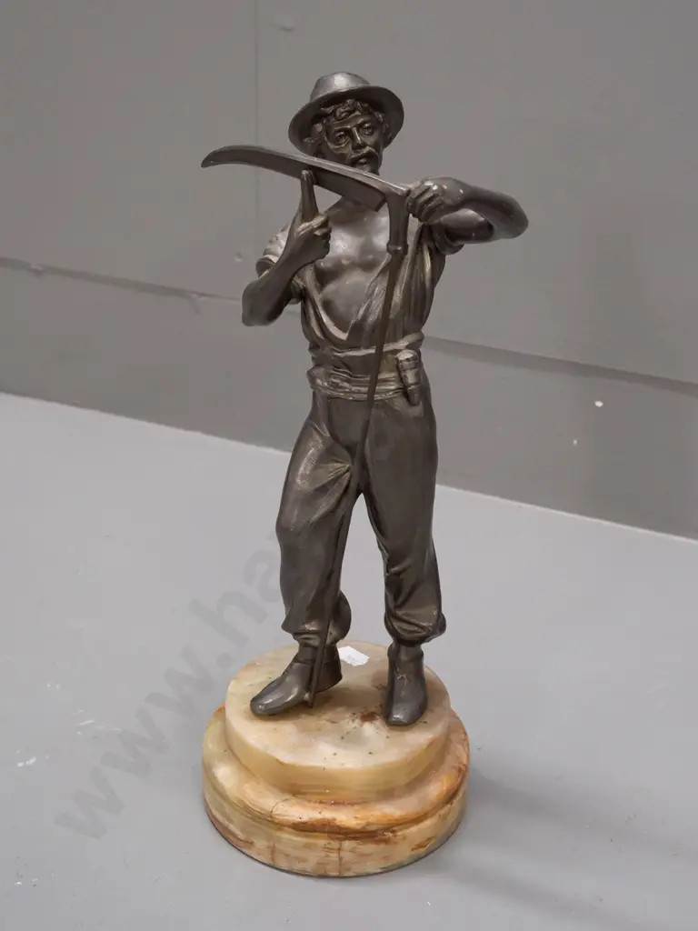 cast metal figure on composite stone base, farmer sharpening scythe. H-320 Image 1++