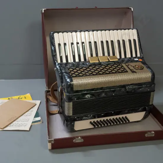 Scandalli piano accordion with case and booklets - some wear to case