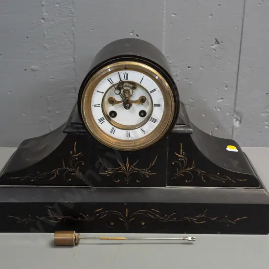 vintage heavy black marble mantle clock w/ etched decoration. Glass bezel front and rear. Enamel face, brass bezel