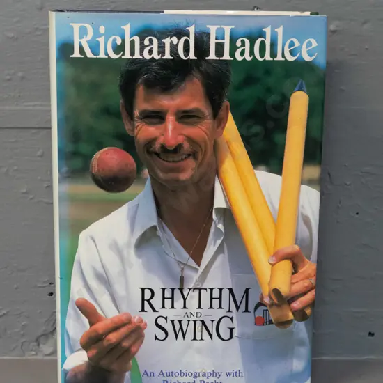autographed hard cover book - Rhythm and Swing, signed by Richard Hadlee - slight split to spine/binding