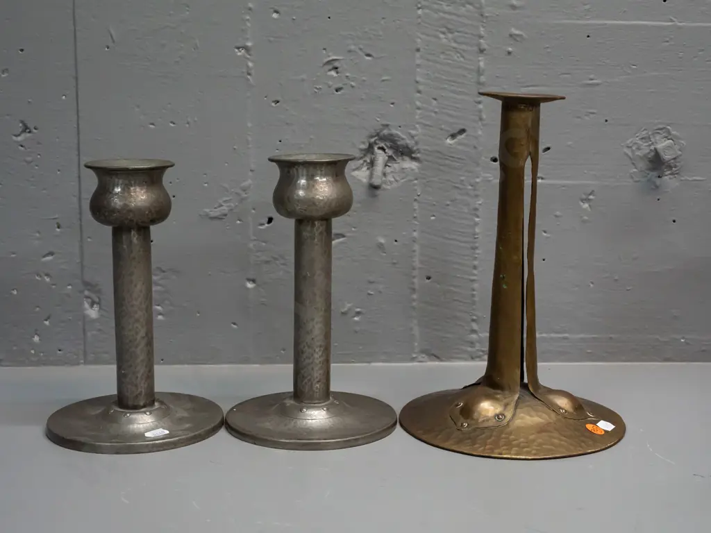 3 English hand-beaten candlesticks - pair of pewter marked Homeland and one brass one H-250. Smaller pair have holes / Image 1++