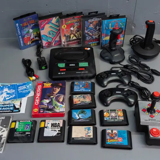 Sega Mega-Drive II 16 Bit video game console with 5 controllers, power supply, 14 game cartridges and a few booklets