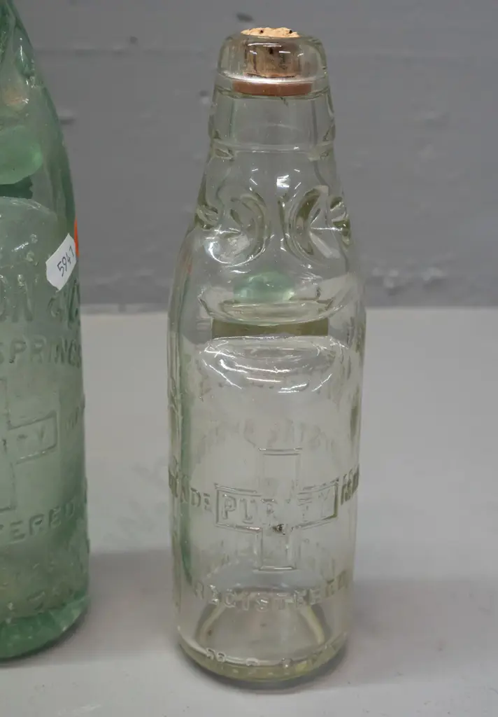 3 clear glass codd / marble bottles - 2 are Mitchell & Co Invercargill, one marked MGB Co. on back, no date, other 1899 Image 1++