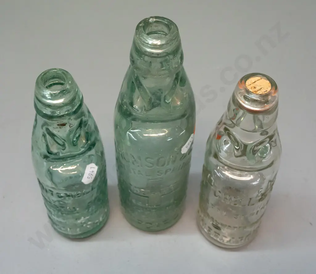 3 clear glass codd / marble bottles - 2 are Mitchell & Co Invercargill, one marked MGB Co. on back, no date, other 1899 Image 1++