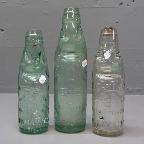 3 clear glass codd / marble bottles - 2 are Mitchell & Co Invercargill, one marked MGB Co. on back, no date, other 1899