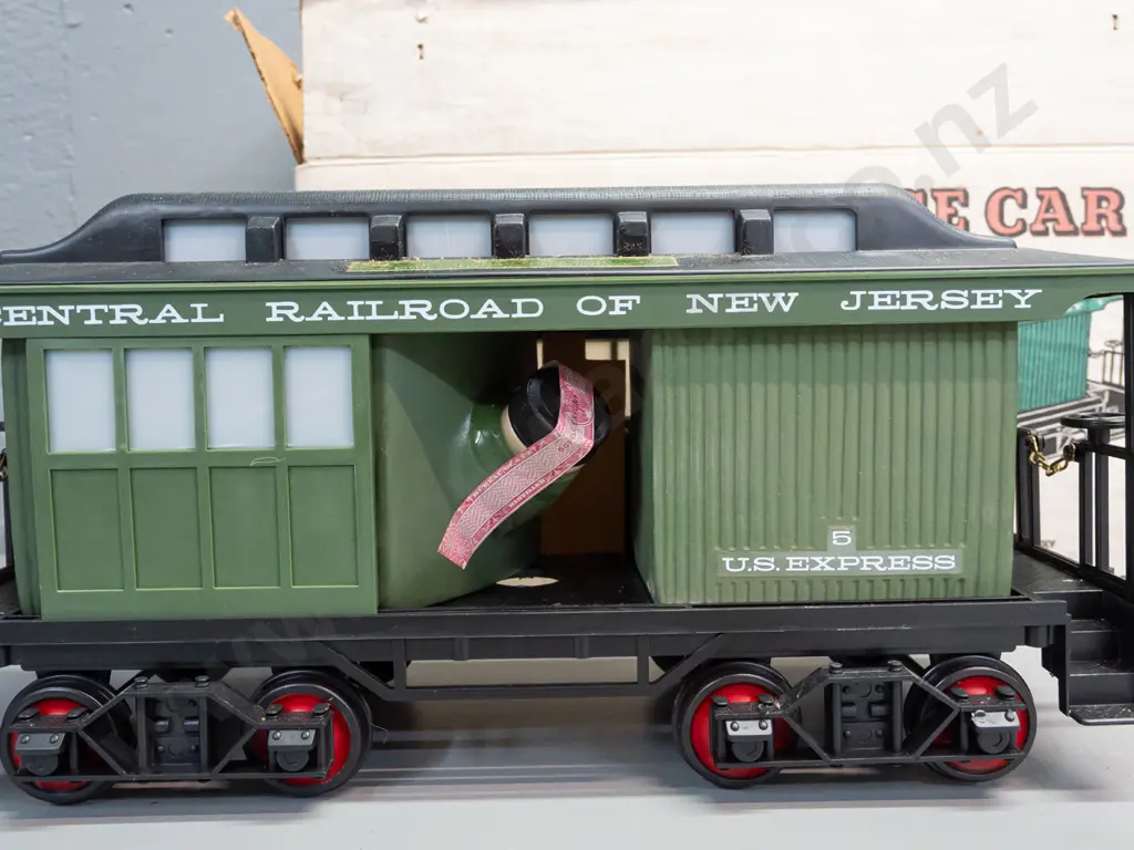 5-piece Jim Beam railway decanter set: Locomotive and 4 cars with New Jersey Central Railroad markings, all sealed with Image 1++